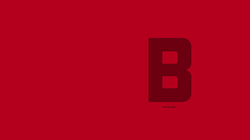 The letter B within a baseline dotted line on red background 